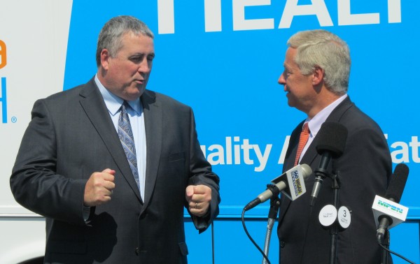 Democrat Steve Woods, left, talks with U.S. Rep. Mike Michaud, D-Maine, Wednesday morning at the Falmouth headquarters of Woods' TideSmart Global facility. Woods announced Wednesday that he would be dropping out of the 2014 Maine gubernatorial race and endorsing Michaud. Democrat Steve Woods, left, talks with U.S. Rep. Mike Michaud, D-Maine, Wednesday morning at the Falmouth headquarters of Woods' TideSmart Global facility. Woods announced Wednesday that he would be dropping out of the 2014 Maine gubernatorial race and endorsing Michaud.
