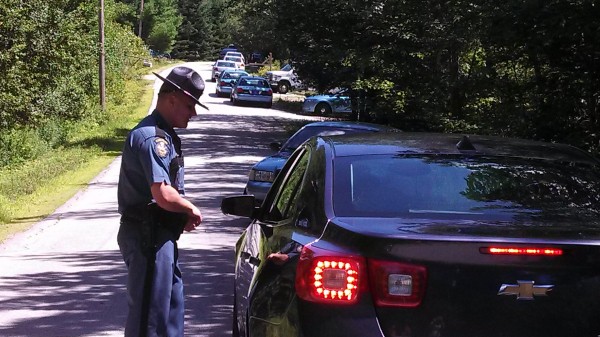 Police redirect cars on Peakes Hill Road Thursday afternoon in Dedham. Police redirect cars on Peakes Hill Road Thursday afternoon in Dedham.