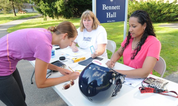 Lindsay Archer, left, of Bangor signs up for Football 101 for Women at the University of Maine on Thursday. Women were taught the rules of football along with a tour of the UMaine football facility. Lindsay Archer, left, of Bangor signs up for Football 101 for Women at the University of Maine on Thursday. Women were taught the rules of football along with a tour of the UMaine football facility.