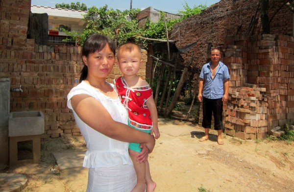 Dong Genlao and his wife, Wang Xiaojuan, with their two year old daughter, believe they were tricked into giving up a baby in 2006 by an obstetrician involved in human trafficking. Dong Genlao and his wife, Wang Xiaojuan, with their two year old daughter, believe they were tricked into giving up a baby in 2006 by an obstetrician involved in human trafficking.