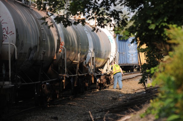 A Pan Am Railways worker looks at rail cars along a section of track near the Coldbrook Road in Hermon on Monday. A Pan Am Railways worker looks at rail cars along a section of track near the Coldbrook Road in Hermon on Monday.