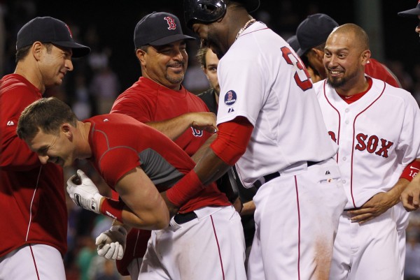 Boston's Stephen Drew (left) is congratulated by David Ortiz (34) after driving in the winning run to defeat the Seattle Mariners 5-4 in 15 innings at 12:20 a.m. Thursday at Fenway Park in Boston.. Boston's Stephen Drew (left) is congratulated by David Ortiz (34) after driving in the winning run to defeat the Seattle Mariners 5-4 in 15 innings at 12:20 a.m. Thursday at Fenway Park in Boston..