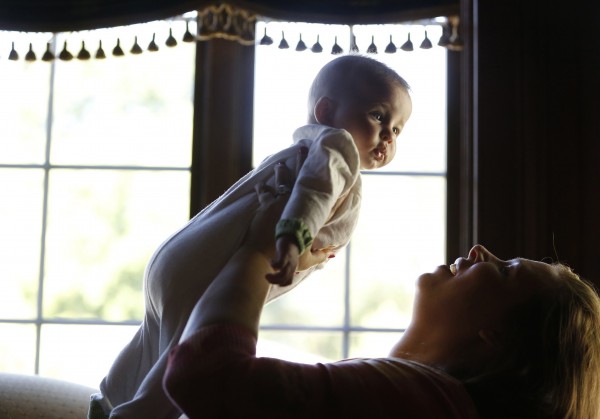 Molly Halper, right, and her 5 month-old baby, Georgette Halper, are photographed in their Arlington Heights, Ill., home, on Aug. 1, 2013. After the birth of Georgette, Molly Halper ingested encapsulated placenta pills made for her by her birth doula. Molly Halper, right, and her 5 month-old baby, Georgette Halper, are photographed in their Arlington Heights, Ill., home, on Aug. 1, 2013. After the birth of Georgette, Molly Halper ingested encapsulated placenta pills made for her by her birth doula.