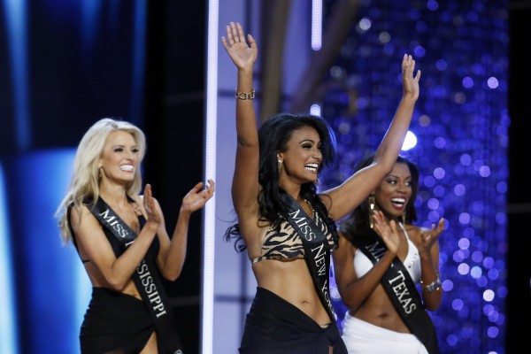 Miss America 2014 contestant, Miss New York Nina Davuluri (C) reacts as she is chosen to move on while competing in the Miss America Pageant in Atlantic City, New Jersey, September 15, 2013. Miss America 2014 contestant, Miss New York Nina Davuluri (C) reacts as she is chosen to move on while competing in the Miss America Pageant in Atlantic City, New Jersey, September 15, 2013.
