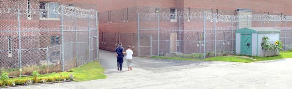 A prisoner is brought down the "runway" into one of the buildings on the sprawling complex at the Maine Correctional Center in Windham. A prisoner is brought down the "runway" into one of the buildings on the sprawling complex at the Maine Correctional Center in Windham.