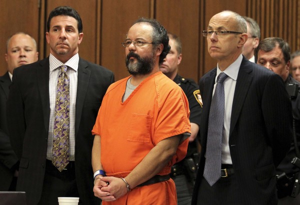 Ariel Castro (C), 53, stands between attorneys Craig Weintraub (L) and Jaye Schlachet as his sentence is read to him by judge Michael J. Russo in the courtroom in Cleveland, Ohio in this August 1, 2013 file photo. Castro, the Cleveland man sentenced to life in prison for the abduction, rape and torture of three women, was found dead in his Ohio jail cell, according to a prison official on September 3, 2013. Ariel Castro (C), 53, stands between attorneys Craig Weintraub (L) and Jaye Schlachet as his sentence is read to him by judge Michael J. Russo in the courtroom in Cleveland, Ohio in this August 1, 2013 file photo. Castro, the Cleveland man sentenced to life in prison for the abduction, rape and torture of three women, was found dead in his Ohio jail cell, according to a prison official on September 3, 2013.