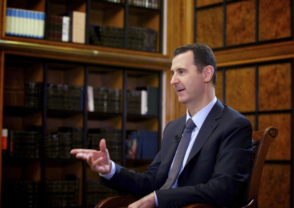 Syria's President Bashar al-Assad speaks during an interview with Russian state television RU24 in Damascus in this September 12, 2013 file handout photo by Syria's national news agency SANA. Syria's President Bashar al-Assad speaks during an interview with Russian state television RU24 in Damascus in this September 12, 2013 file handout photo by Syria's national news agency SANA.