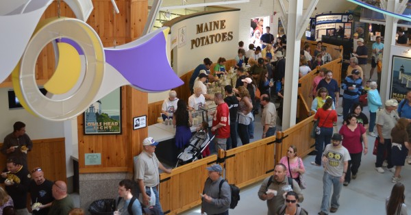 Visitors to the Maine Potato Board booth at the Eastern States Exposition in West Springfield, Mass., make their way through the crowds after purchasing a Maine baked potato during one of the past year's events. Visitors to the Maine Potato Board booth at the Eastern States Exposition in West Springfield, Mass., make their way through the crowds after purchasing a Maine baked potato during one of the past year's events.