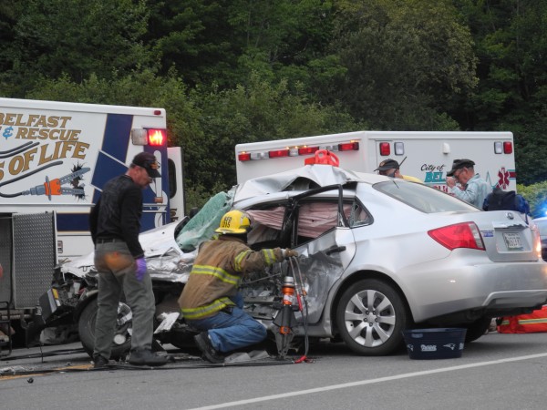 Rescue personnel work Saturday evening to free a driver who was trapped in her car after an accident near the Route 1 Jug Handle in Belfast. The driver was taken to Eastern Maine Medical Center in Bangor by Life Flight helicopter after she was cut out of the car. Rescue personnel work Saturday evening to free a driver who was trapped in her car after an accident near the Route 1 Jug Handle in Belfast. The driver was taken to Eastern Maine Medical Center in Bangor by Life Flight helicopter after she was cut out of the car.