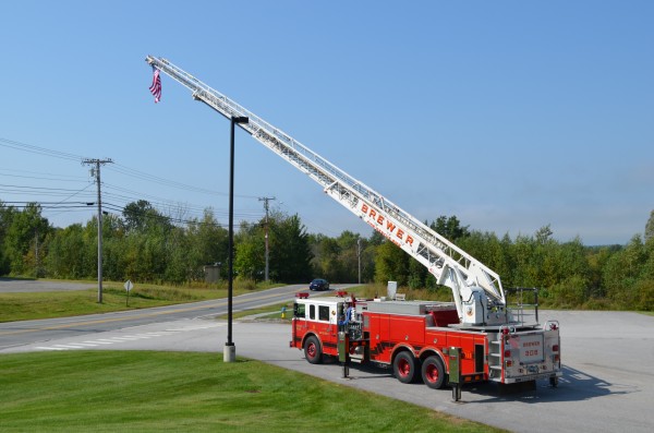 A Brewer Fire Department ladder truck displays the American flag along Parkway South in remembrance of the Sept. 11 terrorist attacks in 2001. Several people driving by honked their horns on Wednesday. A Brewer Fire Department ladder truck displays the American flag along Parkway South in remembrance of the Sept. 11 terrorist attacks in 2001. Several people driving by honked their horns on Wednesday.