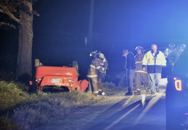 Rescue crews attend to the scene of a crash that sent three people to the hospital with serious injuries in Corinna on Monday night. Rescue crews attend to the scene of a crash that sent three people to the hospital with serious injuries in Corinna on Monday night.