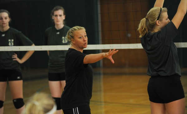Husson volleyball coach Jodie Fairbank coaches her team during a practice at Husson University on Monday. Husson volleyball coach Jodie Fairbank coaches her team during a practice at Husson University on Monday.