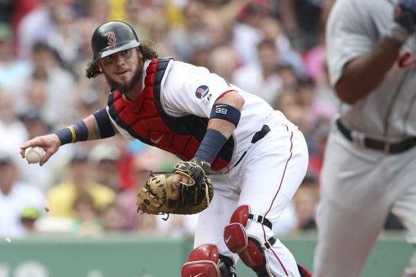 Boston Red Sox catcher Jarrod Saltalamacchia fields the ball against the Detroit Tigers in the third inning Monday in Boston.
Boston Red Sox catcher Jarrod Saltalamacchia fields the ball against the Detroit Tigers in the third inning Monday in Boston.