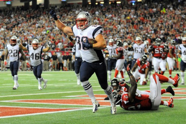 New England Patriots tight end Matthew Mulligan (88) reacts after catching a touchdown pass behind Atlanta Falcons safety William Moore (25) and linebacker Akeem Dent (52) during the second quarter Sunday night at the Georgia Dome in Atlanta. It was the second NFL touchdown for Mulligan, an Enfield, Maine, native. New England Patriots tight end Matthew Mulligan (88) reacts after catching a touchdown pass behind Atlanta Falcons safety William Moore (25) and linebacker Akeem Dent (52) during the second quarter Sunday night at the Georgia Dome in Atlanta. It was the second NFL touchdown for Mulligan, an Enfield, Maine, native.