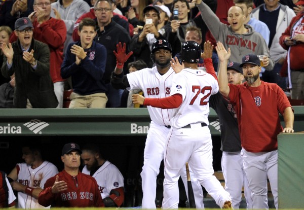 Boston's Xander Bogaerts (72) is met by his teammates after scoring in the seventh inning against the New York Yankees at Fenway Park in Boston Sunday night. Boston's Xander Bogaerts (72) is met by his teammates after scoring in the seventh inning against the New York Yankees at Fenway Park in Boston Sunday night.