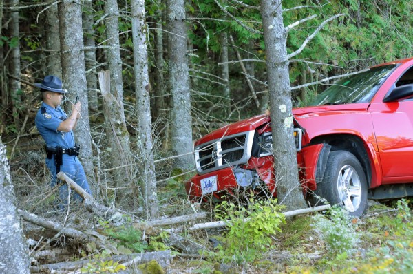 State Trooper Jessie Duda takes a snapshot with his phone of the pickup truck that Jason Brown was driving and crashed into a tree beside Interstate 95 at mile 170 in Carmel. State Trooper Jessie Duda takes a snapshot with his phone of the pickup truck that Jason Brown was driving and crashed into a tree beside Interstate 95 at mile 170 in Carmel.
