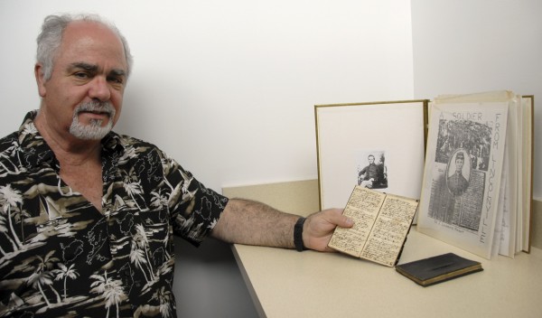 James Lawrence "Larry" Knight of Manchester, Conn. displays the two small diaries that his great-grandfather, Adelbert Knight of Belfast, kept while serving in the 11th Infantry, United States Army, during the Civil War. Behind the diaries is an album containing the diary entries that Larry Knight transcribed in 1970, when he was a high school senior. One diary includes many entries that Adelbert Knight made while imprisoned at Andersonville, Ga. James Lawrence "Larry" Knight of Manchester, Conn. displays the two small diaries that his great-grandfather, Adelbert Knight of Belfast, kept while serving in the 11th Infantry, United States Army, during the Civil War. Behind the diaries is an album containing the diary entries that Larry Knight transcribed in 1970, when he was a high school senior. One diary includes many entries that Adelbert Knight made while imprisoned at Andersonville, Ga.