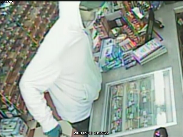 Video surveillance footage from the Checkout convenience store in Glenburn shows a man who walked into the store armed with a hunting knife Sunday afternoon and demanded money. Police are searching for the suspect in the robbery. Video surveillance footage from the Checkout convenience store in Glenburn shows a man who walked into the store armed with a hunting knife Sunday afternoon and demanded money. Police are searching for the suspect in the robbery.