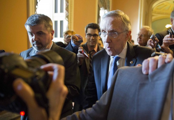 Senate Majority Leader Harry Reid (D-NV) speaks to reporters during the government shutdown in Washington, Oct. 14, 2013. Negotiations under way in the Senate to end the 14-day-old shutdown could pave the way for a bill that would fund the federal government until no later than Jan. 15. Senate Majority Leader Harry Reid (D-NV) speaks to reporters during the government shutdown in Washington, Oct. 14, 2013. Negotiations under way in the Senate to end the 14-day-old shutdown could pave the way for a bill that would fund the federal government until no later than Jan. 15.