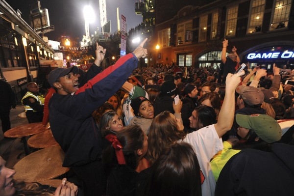 Boston Red Sox fans react to their team winning the MLB baseball's World Series after beating St. Louis Cardinals in Game 6, at Landsdown Street near Fenway Park in Boston October 30, 2013. Boston Red Sox fans react to their team winning the MLB baseball's World Series after beating St. Louis Cardinals in Game 6, at Landsdown Street near Fenway Park in Boston October 30, 2013.
