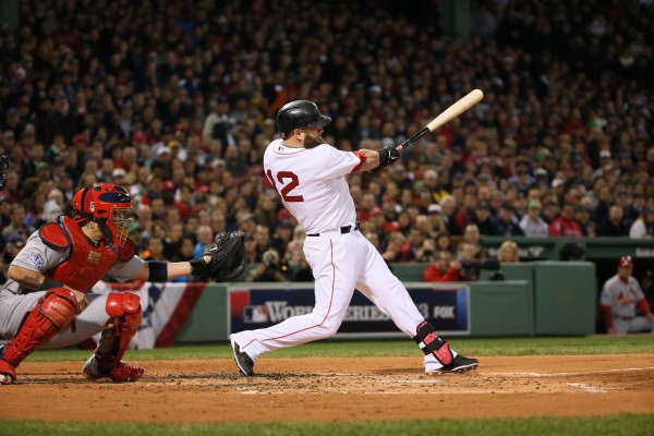 Mike Napoli of the Boston Red Sox drives in three runs with a double in the first inning against the St. Louis Cardinals in Game 1 of the World Series at Fenway Park in Boston, Massachusetts, on Wednesday, October 23, 2013. Mike Napoli of the Boston Red Sox drives in three runs with a double in the first inning against the St. Louis Cardinals in Game 1 of the World Series at Fenway Park in Boston, Massachusetts, on Wednesday, October 23, 2013.