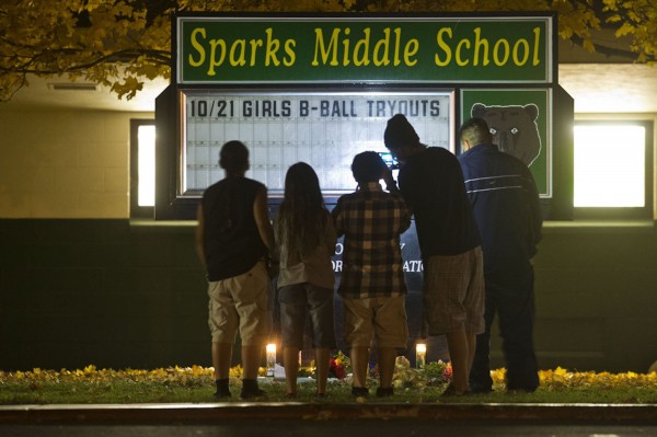 A family takes a photo of a memorial after a shooting at Spark Middle School in Sparks, Nevada, on Monday, October 21, 2013. A family takes a photo of a memorial after a shooting at Spark Middle School in Sparks, Nevada, on Monday, October 21, 2013.