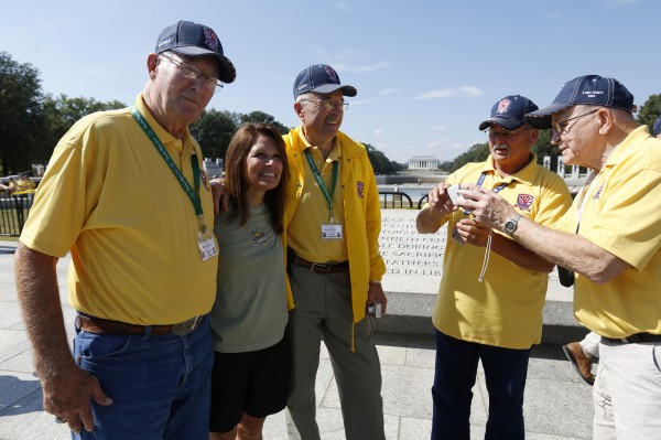 U.S. Representative Michele Bachmann (R-MN) (2nd L) poses for photos with veterans at the World War Two Memorial in Washington October 1, 2013. Despite the U.S. government shutdown affecting the site, a barricade was removed to give veterans accessed the memorial. Up to one million federal workers were thrown temporarily out of work on Tuesday as the U.S. government partially shut down for the first time in 17 years in a standoff between President Barack Obama and congressional Republicans over healthcare reforms. U.S. Representative Michele Bachmann (R-MN) (2nd L) poses for photos with veterans at the World War Two Memorial in Washington October 1, 2013. Despite the U.S. government shutdown affecting the site, a barricade was removed to give veterans accessed the memorial. Up to one million federal workers were thrown temporarily out of work on Tuesday as the U.S. government partially shut down for the first time in 17 years in a standoff between President Barack Obama and congressional Republicans over healthcare reforms.