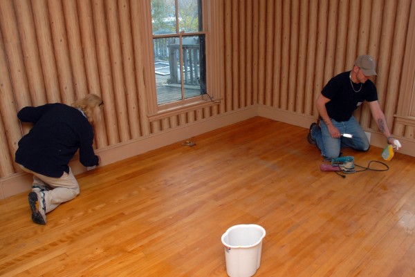 Dennis Smith, left, and Wade Davis scrape stains from the floor at 19 Central St. during renovations on Friday, Oct. 25, 2013. Dennis Smith, left, and Wade Davis scrape stains from the floor at 19 Central St. during renovations on Friday, Oct. 25, 2013.