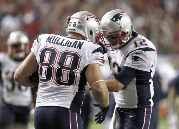 New England Patriots tight end Matthew Mulligan (88) celebrates with quarterback Tom Brady (12) after scoring a touchdown in the first half against the Atlanta Falcons during their NFL football game in Atlanta September 29, 2013. New England Patriots tight end Matthew Mulligan (88) celebrates with quarterback Tom Brady (12) after scoring a touchdown in the first half against the Atlanta Falcons during their NFL football game in Atlanta September 29, 2013.