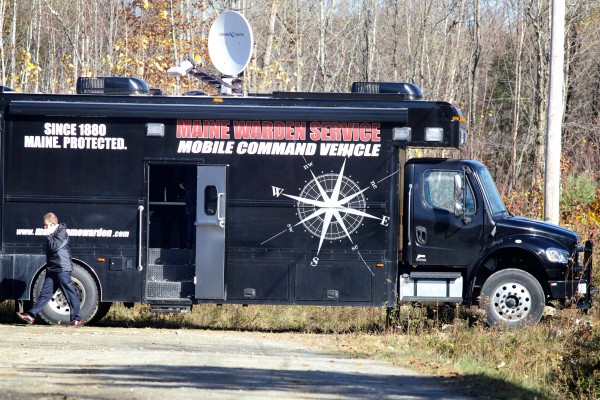 A law enforcement official talks on a phone near a Maine Warden Service vehicle off Hussey Hill Road in Oakland Wednesday, where the search for Ayla Reynolds continues. A law enforcement official talks on a phone near a Maine Warden Service vehicle off Hussey Hill Road in Oakland Wednesday, where the search for Ayla Reynolds continues.