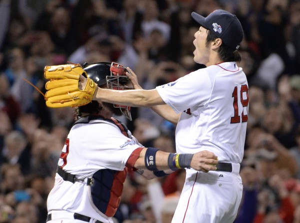 Boston Red Sox relief pitcher Koji Uehara (19) celebrates with catcher Jarrod Saltalamacchia after defeating the Detroit Tigers in game six of the American League Championship Series at Fenway Park in Boston Saturday night. Boston Red Sox relief pitcher Koji Uehara (19) celebrates with catcher Jarrod Saltalamacchia after defeating the Detroit Tigers in game six of the American League Championship Series at Fenway Park in Boston Saturday night.