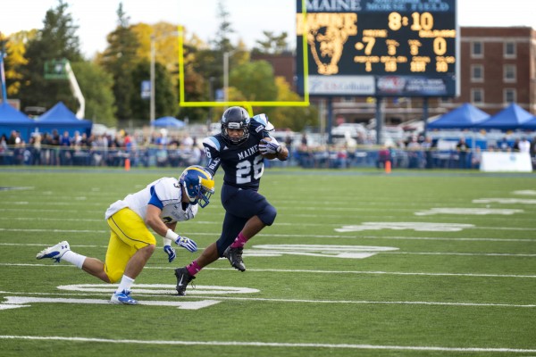 The University of Maine's Nigel Jones advances the ball against the University of Delaware's Craig Brodsky during the first quarter on Saturday afternoon at Morse Field in Orono. The University of Maine's Nigel Jones advances the ball against the University of Delaware's Craig Brodsky during the first quarter on Saturday afternoon at Morse Field in Orono.