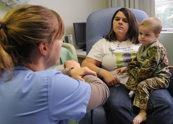 Two- year-old cancer patient Tripp Murray sits with his mother Kim Tripp as certified nuclear medicine technologist Kaity Cameron explains Tripp's procedure at Eastern Maine Medical Center in Bangor on Tuesday. Two- year-old cancer patient Tripp Murray sits with his mother Kim Tripp as certified nuclear medicine technologist Kaity Cameron explains Tripp's procedure at Eastern Maine Medical Center in Bangor on Tuesday.