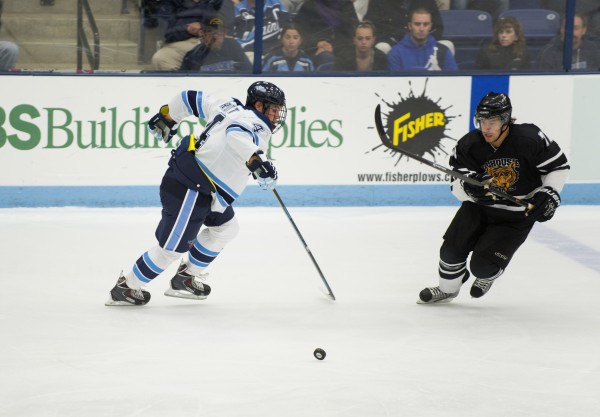 The University of Maine's Jake Rutt (left) tries to take possession of the puck from Dalhousie University's Chris Ivanko during the second period Sunday at the Alfond Arena in Orono. The University of Maine's Jake Rutt (left) tries to take possession of the puck from Dalhousie University's Chris Ivanko during the second period Sunday at the Alfond Arena in Orono.