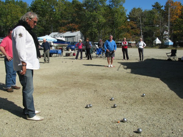 French petanque player Marco Foyot, one of the best players in the world, watches as Mainers try their hand at the game Sunday during a tournament with the Maine Boules Club. French petanque player Marco Foyot, one of the best players in the world, watches as Mainers try their hand at the game Sunday during a tournament with the Maine Boules Club.