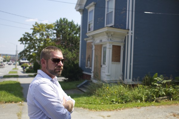 Code enforcement officer Jeremy Martin shows 308 Hammond St. in Bangor, which has been boarded up to prevent vandalism inside. Code enforcement officer Jeremy Martin shows 308 Hammond St. in Bangor, which has been boarded up to prevent vandalism inside.
