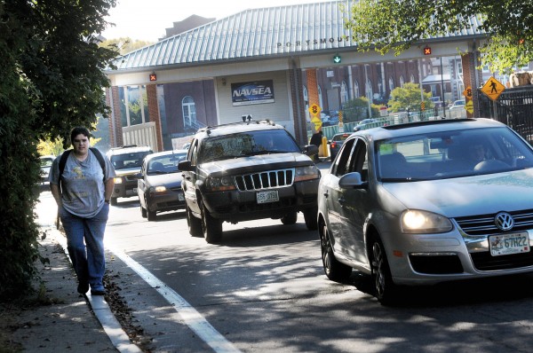 Heather Sheldon, a first-year apprentice, walks away from Portsmouth Naval Shipyard in Kittery alongside a stream of departing cars after she and others received furlough letters from the government Tuesday morning. Heather Sheldon, a first-year apprentice, walks away from Portsmouth Naval Shipyard in Kittery alongside a stream of departing cars after she and others received furlough letters from the government Tuesday morning.