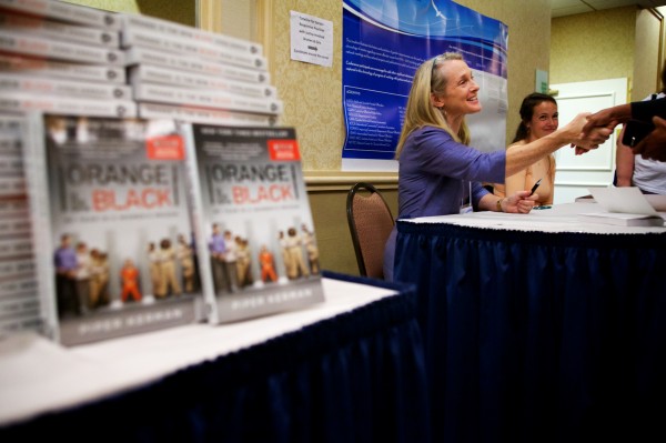 Piper Kerman, author of "Orange is the New Black," signs her book in Portland Tuesday at a Tuesday conference about women in prison. The book has been adapted into an acclaimed show on Netflix. Piper Kerman, author of "Orange is the New Black," signs her book in Portland Tuesday at a Tuesday conference about women in prison. The book has been adapted into an acclaimed show on Netflix.