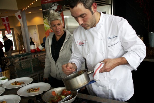 Winner of the Harvest on the Harbor lobster cooking contest Chef Chris Long, of Natalie's at the Camden Harbour Inn, prepares butter poached lobster with grilled local mushrooms, corn, parsnip ragout and thyme butter while host Michele Ragussis looks on Thursday in Portland. Winner of the Harvest on the Harbor lobster cooking contest Chef Chris Long, of Natalie's at the Camden Harbour Inn, prepares butter poached lobster with grilled local mushrooms, corn, parsnip ragout and thyme butter while host Michele Ragussis looks on Thursday in Portland.