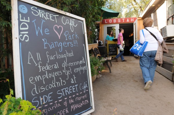 A sign at the Side Street Cafe in Bar Harbor offers a discount to Acadia National Park employees who have been furloughed because of the federal government shutdown. Owner Jena Young said some employees have taken advantage of the discount as of lunch time on Tuesday. Kevin Bennett | BDN A sign at the Side Street Cafe in Bar Harbor offers a discount to Acadia National Park employees who have been furloughed because of the federal government shutdown. Owner Jena Young said some employees have taken advantage of the discount as of lunch time on Tuesday. Kevin Bennett | BDN