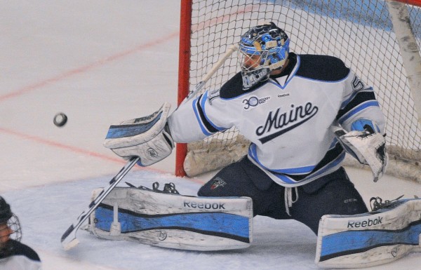 The University of Maine's Martin Ouellette makes a save during the game against UMass in Orono Saturday. The University of Maine's Martin Ouellette makes a save during the game against UMass in Orono Saturday.