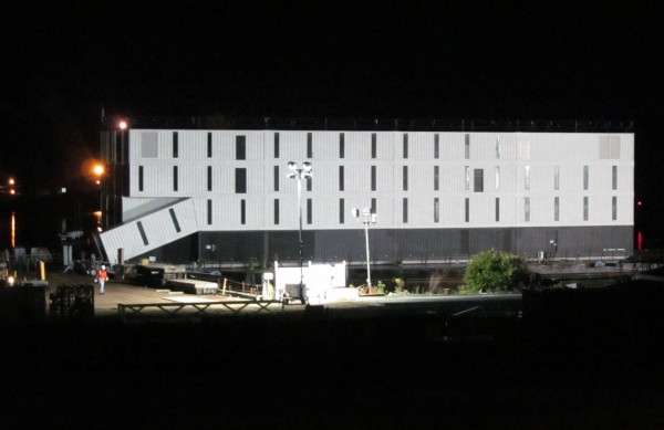 A mysterious four-story structure is docked on a barge at Cianbro's Rickers Wharf Marine Facility on the West End of Portland Thursday night. The structure was shipped to Portland from Connecticut, where it was shrouded in secrecy and the focus of intense speculation. A mysterious four-story structure is docked on a barge at Cianbro's Rickers Wharf Marine Facility on the West End of Portland Thursday night. The structure was shipped to Portland from Connecticut, where it was shrouded in secrecy and the focus of intense speculation.