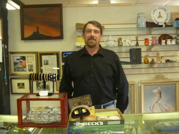 Arthur Carlow stands behind the counter, ready for business at the Hampden Antiques Mall, 281 Western Ave. in Hampden. Carlow, owner of the mall, opened the store on Sept. 4. Arthur Carlow stands behind the counter, ready for business at the Hampden Antiques Mall, 281 Western Ave. in Hampden. Carlow, owner of the mall, opened the store on Sept. 4.