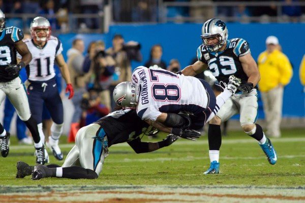 Nov 18, 2013; Charlotte, NC, USA; Carolina Panthers strong safety Robert Lester (38) tackles New England Patriots tight end Rob Gronkowski (87) during the fourth quarter at Bank of America Stadium. The Panthers defeated the Patriots 24-20. Nov 18, 2013; Charlotte, NC, USA; Carolina Panthers strong safety Robert Lester (38) tackles New England Patriots tight end Rob Gronkowski (87) during the fourth quarter at Bank of America Stadium. The Panthers defeated the Patriots 24-20.