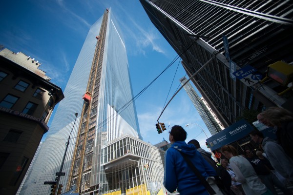 Pedestrians look up at the 4 World Trade Center building in New York in September. The first skyscraper at lower Manhattanâs World Trade Center opens Wednesday with two days of ceremonies. Pedestrians look up at the 4 World Trade Center building in New York in September. The first skyscraper at lower Manhattanâs World Trade Center opens Wednesday with two days of ceremonies.
