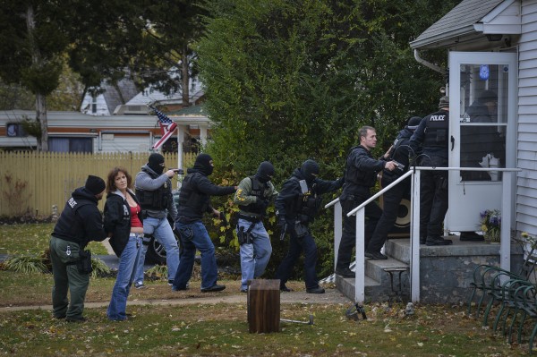 Members of the Manassas/Manassas Park/Prince William Narcotics Task Force arrest Terri Hilbrand, second from left, on Nov. 12, 2013 at her Manassas Park, Va. home. She is accused of distributing prescription pills illegally. Members of the Manassas/Manassas Park/Prince William Narcotics Task Force arrest Terri Hilbrand, second from left, on Nov. 12, 2013 at her Manassas Park, Va. home. She is accused of distributing prescription pills illegally.