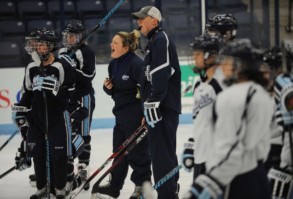 University of Maine women's hockey coaches Sara Simard Reichenbach and Richard Reichenbach give out instructions to their team during a practice Tuesday at Alfond Arena. The Reichenbachs are the interim coaches of the University of Maine women's hockey team and are also husband and wife, who were married on Oct. 14. University of Maine women's hockey coaches Sara Simard Reichenbach and Richard Reichenbach give out instructions to their team during a practice Tuesday at Alfond Arena. The Reichenbachs are the interim coaches of the University of Maine women's hockey team and are also husband and wife, who were married on Oct. 14.