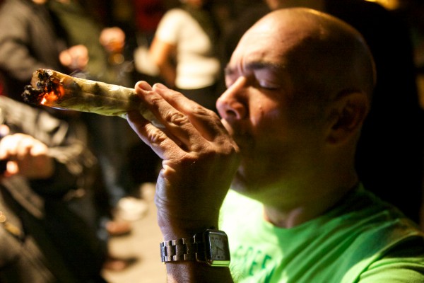 Green Party activist John Eder smokes a joint at the "Yes on 1" headquarters in Portland Tuesday night after declaring victory in a referendum to legalize recreational use of marijuana in the city. Green Party activist John Eder smokes a joint at the "Yes on 1" headquarters in Portland Tuesday night after declaring victory in a referendum to legalize recreational use of marijuana in the city.