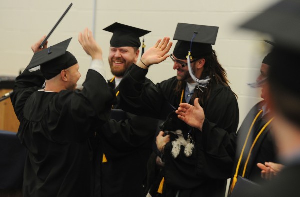 Inmates Jon Brent Dyer, left, Jerry James Banks, center and Brandon Brown celebrate getting diplomas from the University of Maine at Augusta during a ceremony on Monday at the Maine State Prison. Inmates Jon Brent Dyer, left, Jerry James Banks, center and Brandon Brown celebrate getting diplomas from the University of Maine at Augusta during a ceremony on Monday at the Maine State Prison.