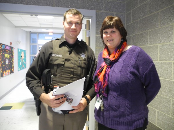 Deputy Nick Oettinger of the Waldo County Sheriff's Office and Mount View High School alternative education teacher Patty Armstrong after a Thursday school assembly about the dangers of texting while driving. Armstrong's 20-year-old daughter was killed by a texting driver four years ago while she was studying abroad in Austria. Deputy Nick Oettinger of the Waldo County Sheriff's Office and Mount View High School alternative education teacher Patty Armstrong after a Thursday school assembly about the dangers of texting while driving. Armstrong's 20-year-old daughter was killed by a texting driver four years ago while she was studying abroad in Austria.